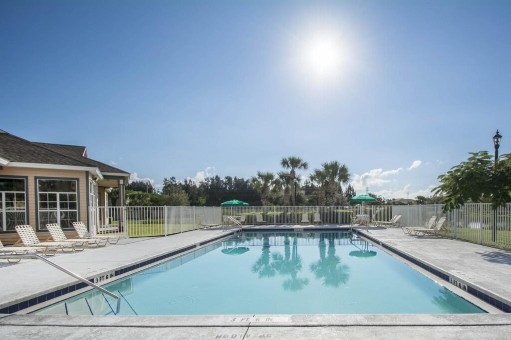 Indian River Apartments pool and clubhouse area in Vero Beach.