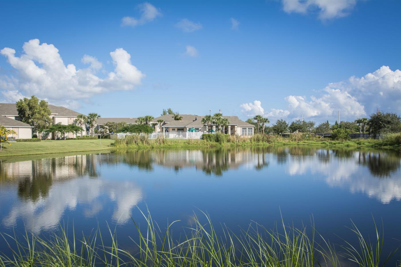 Lagoon and apartment community at Indian River Apartments in Vero Beach.